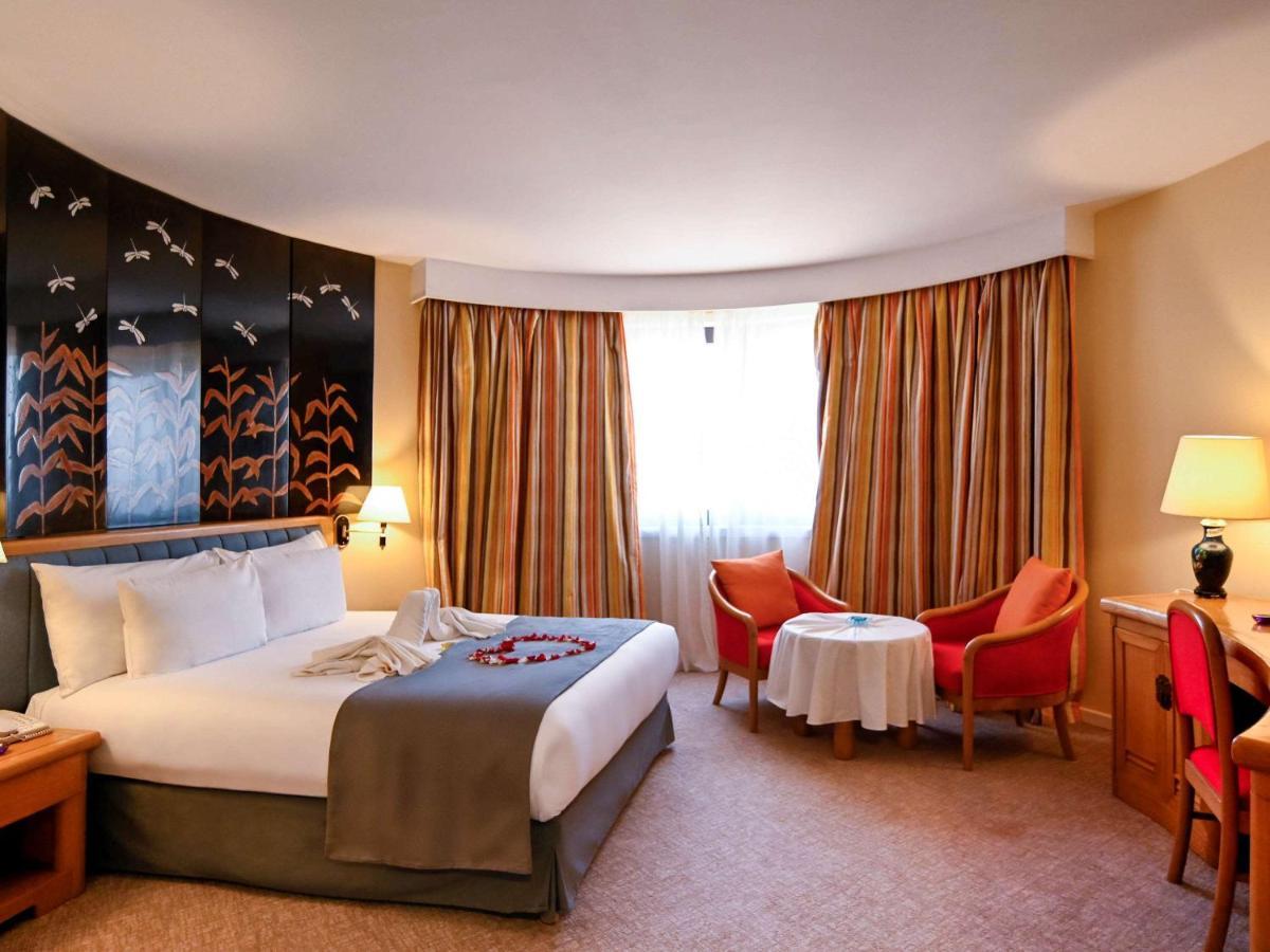Hotel Mercure Alger Aeroport Dar el Beïda Kültér fotó A room at the hotel