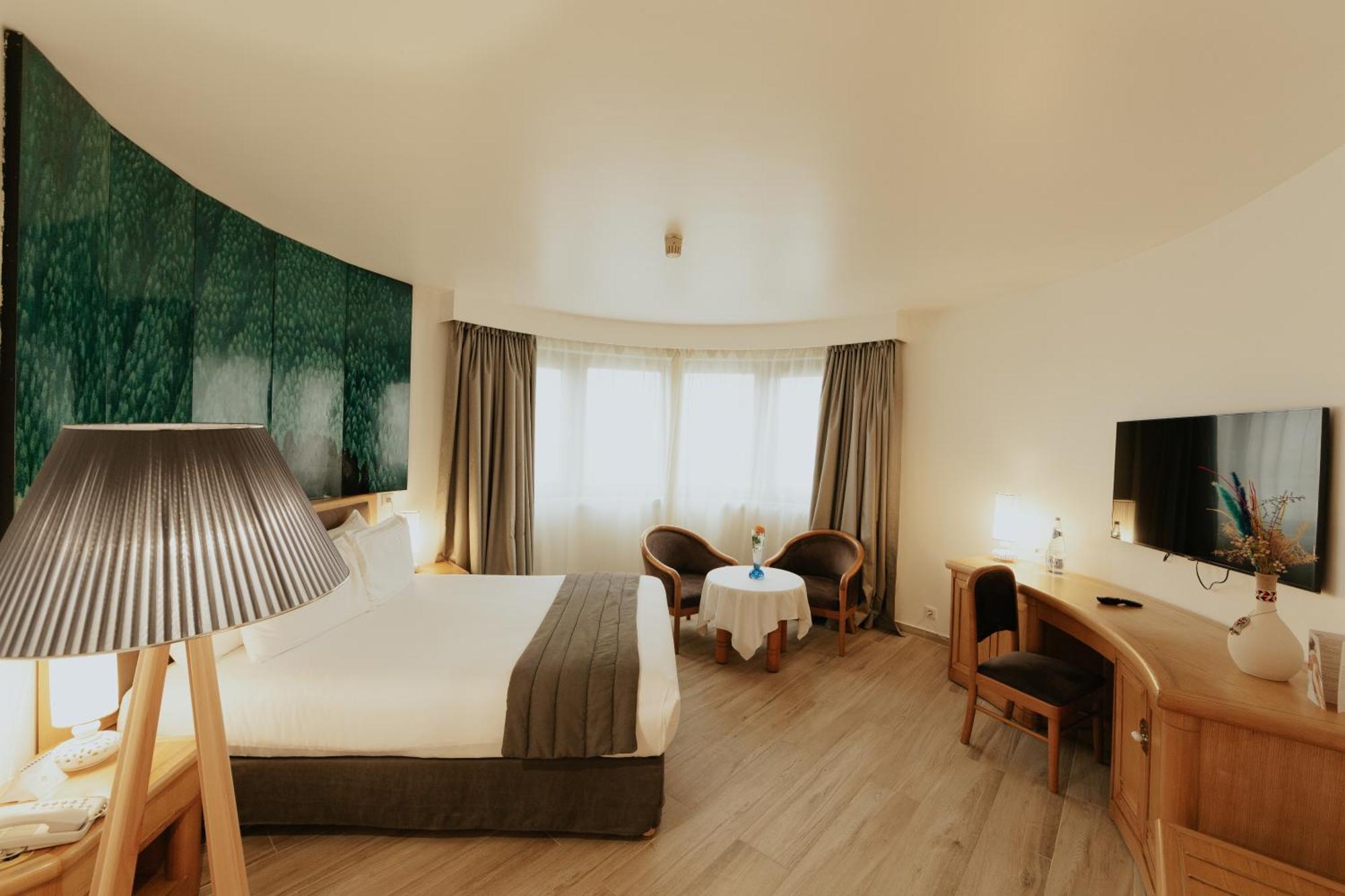 Hotel Mercure Alger Aeroport Dar el Beïda Kültér fotó A room at the hotel